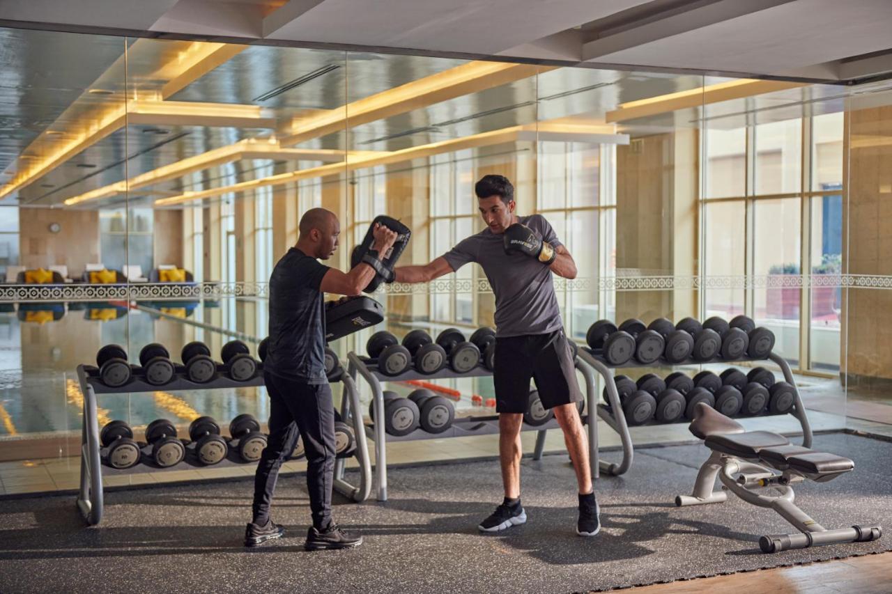 Grand Hyatt Doha Hotel & Villas Exterior photo Personal trainer with a client