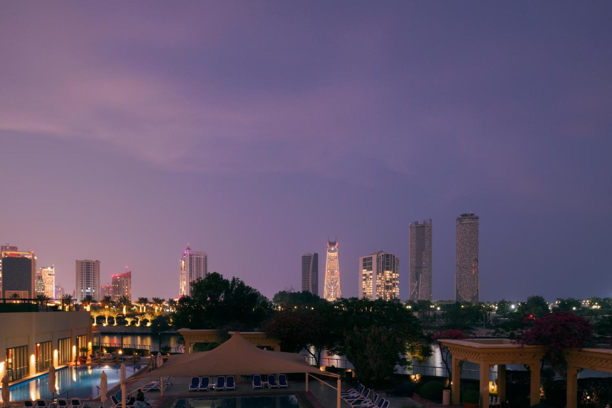 Grand Hyatt Doha Hotel & Villas Exterior photo View of the city at night